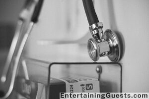 An elegant, cozy living room scene with a homemade charcuterie board, a deck of cards, and a small, stylish DIY decor piece, all bathed in the warm glow of candlelight