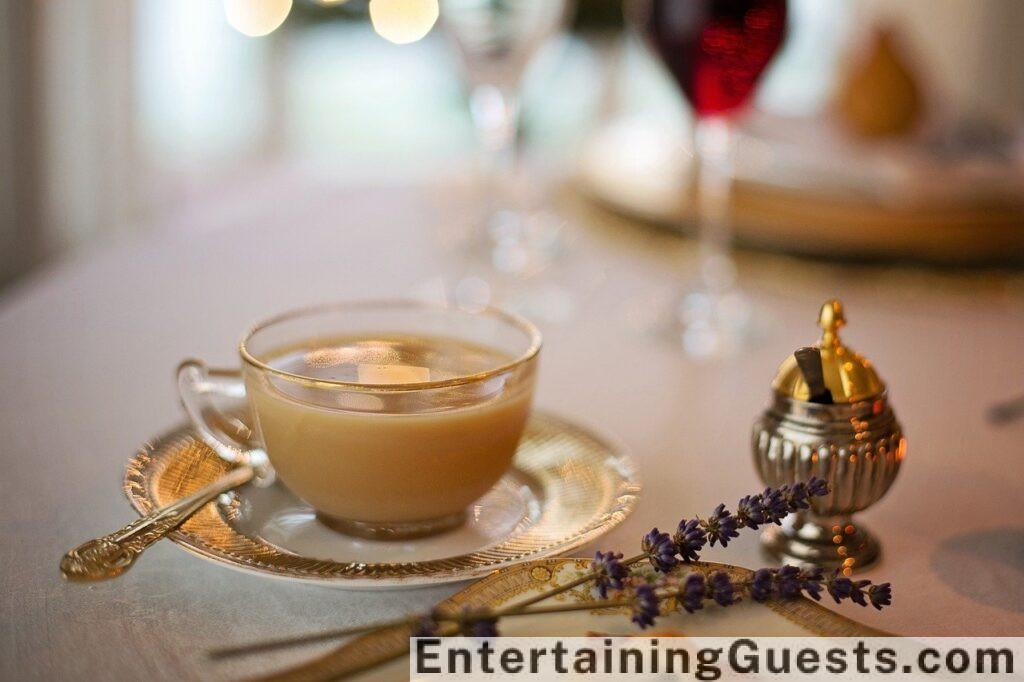 An image showcasing a rustic Thanksgiving table setting featuring warm, earthy tones, natural wood, autumn leaves, candles, and vintage tableware, radiating a cozy and inviting atmosphere for guests