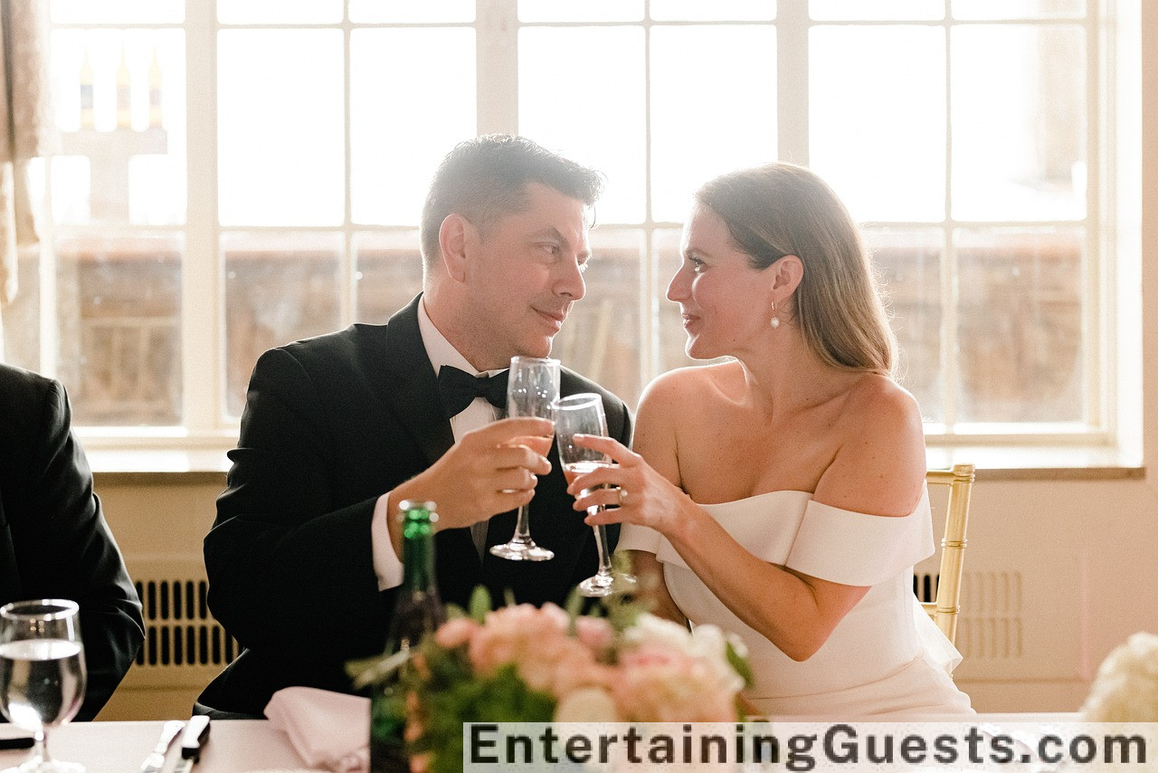 An elegant image featuring a vintage string quartet, guests laughing around a grand banquet table, a couple dancing softly, and a corner with old-fashioned board games set up under soft, ambient lighting