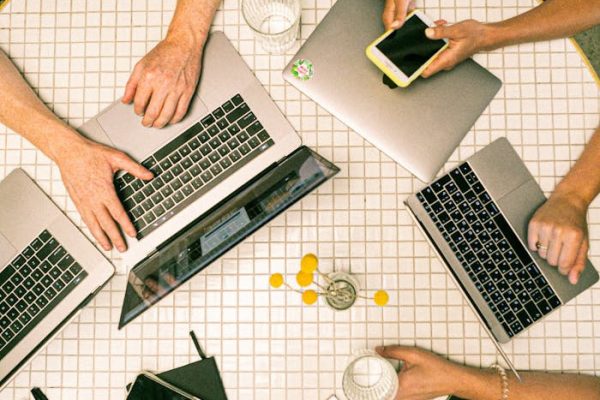 Photo Of People Using Laptop